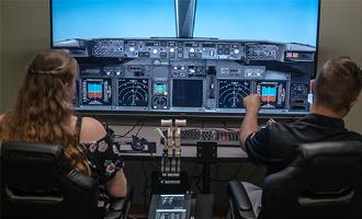 flight simulator with 2 students
