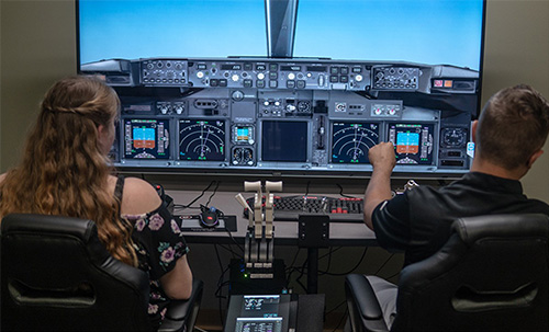 flight simulator with 2 students