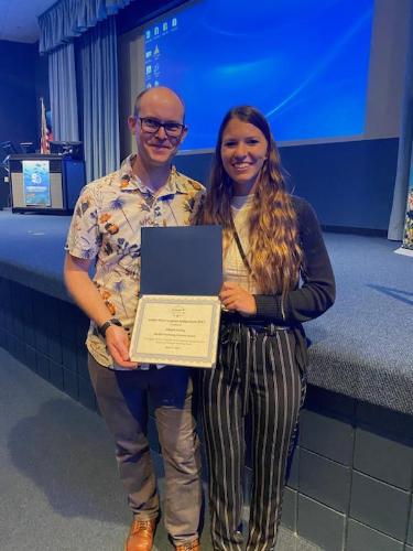 Dr. Fox and Abbey Gering holding Abbey's Promising Young Scientist award