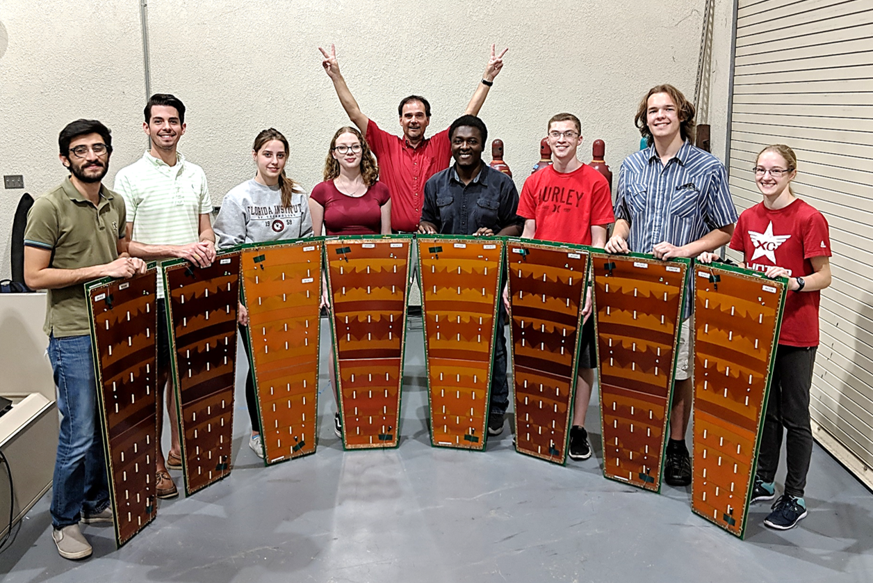 Victory! Successful end of mass production for CMS GE1/1 GEM chambers at FIT. These chambers will be installed in CMS in summer 2019. From left: Mehdi, Stephen, Jacqui, Sarah, Dr. Hohlmann, Jerry, John, Michael, Samantha