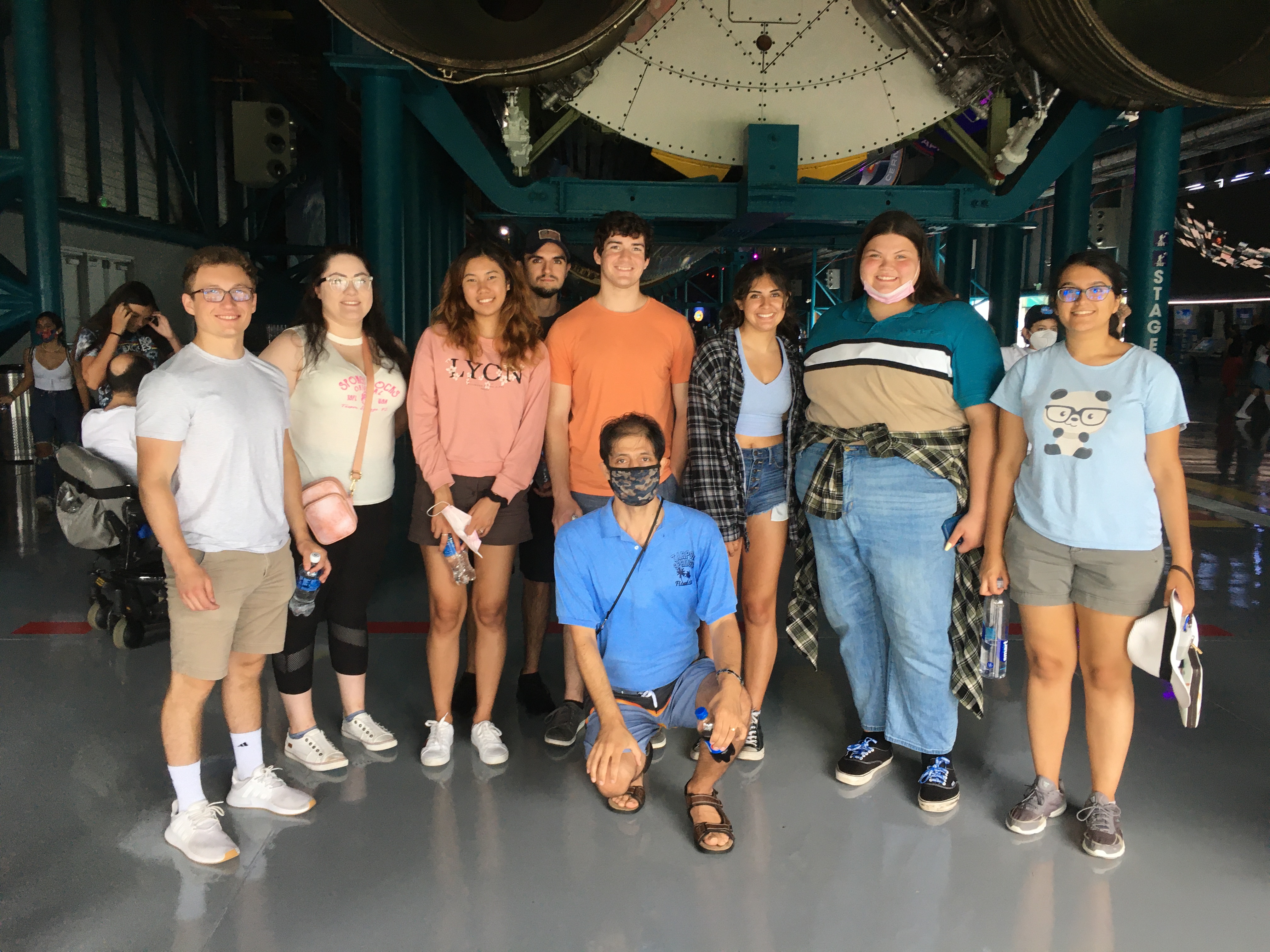 Students in front of Saturn V rocket at Kennedy Space Center